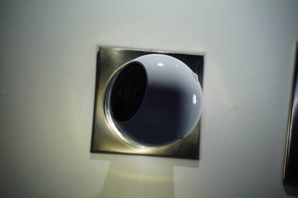 istock Video camera security system on the wall of the building 851337432