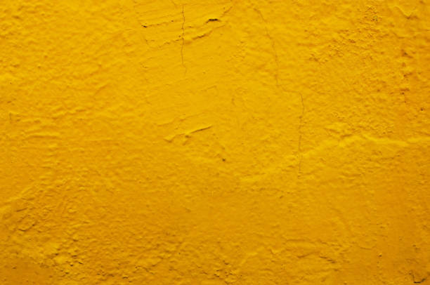 istock yellow concrete or cement wall with vintage style pattern for background and design art work, old grungy texture. 851337910