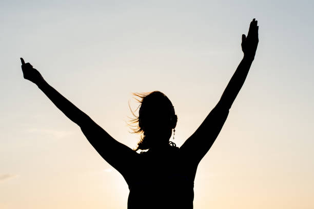 istock Silhouette of girl at sunset 851340372