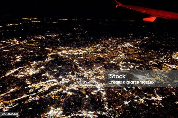 Flying At Night Over Cities Below Stock Photo - Download Image Now - Above, Airplane, Below