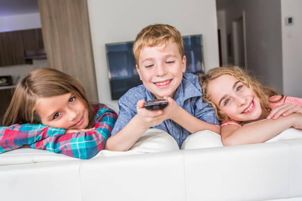 istock child watching TV at home 851364270