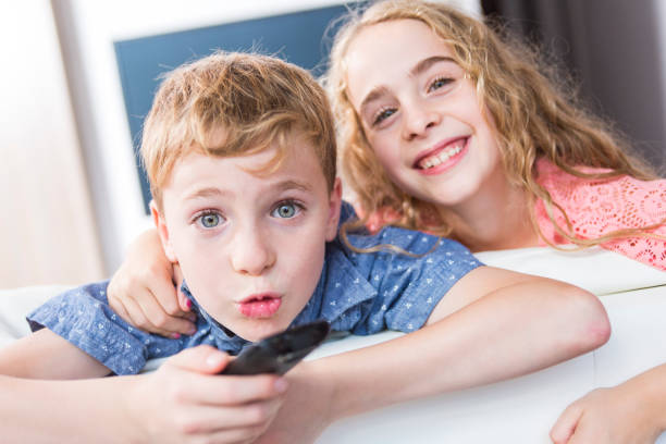 istock child watching TV at home 851364352
