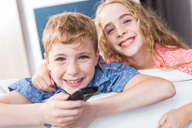istock child watching TV at home 851364396