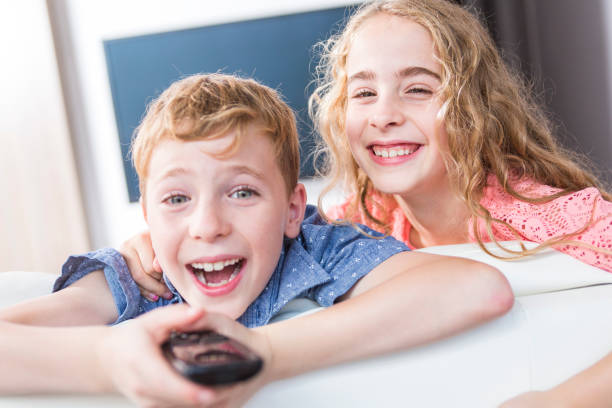 istock child watching TV at home 851364436