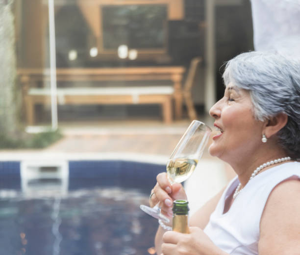 istock Senior woman drinking wine 851369010