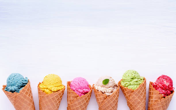 Various of ice cream flavor in cones blueberry ,strawberry ,pistachio ,almond ,orange and cherry setup on white wooden background . Summer and Sweet menu concept. Various of ice cream flavor in cones blueberry ,strawberry ,pistachio ,almond ,orange and cherry setup on white wooden background . Summer and Sweet menu concept. cone shape photos stock pictures, royalty-free photos & images
