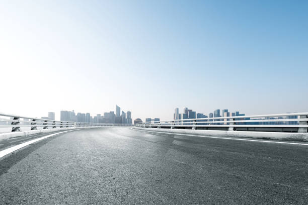 istock empty asphalt road with cityscape of modern city 851396566