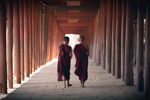 Novices walking at old temple, Salay Bagan Myanmar