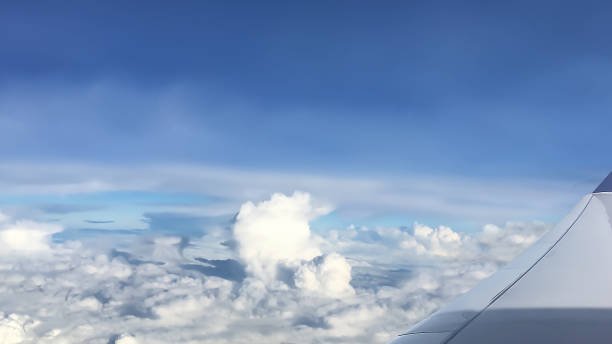 istock Dramatic atmosphere panorama view of blue sky and clouds looking from aircraft window. 851428890