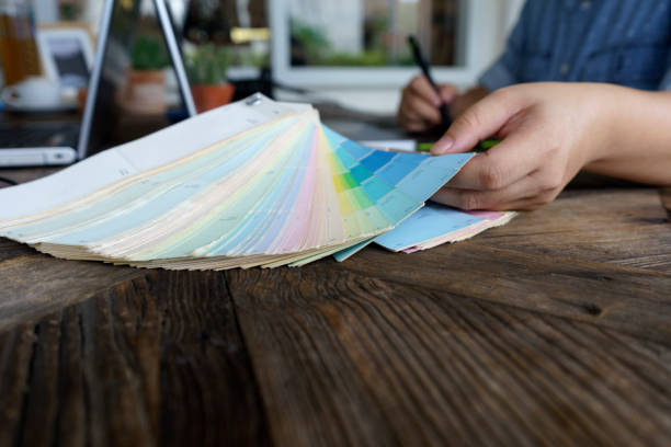 istock Graphic designer working with computer and color tone paper 851429030