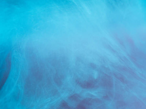 istock Abstract colored background. Blue smoke, ink in water, the patterns of the universe. Abstract movement, frozen multicolor flow of paint. Horizontal photo with soft focus, blurred backdrop 851431912