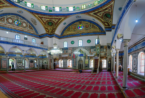 Acre: View of the interior of El-Jazzar Mosque (the white mosque), with prayers, in Acre (Akko), Israel