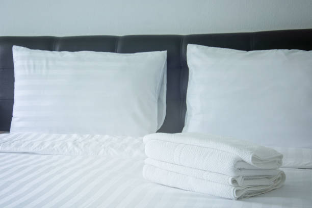 istock white pillow and blanket with wrinkle messy on bed in bedroom with lighting upper left side, from sleeping in a long night winter. 851435030