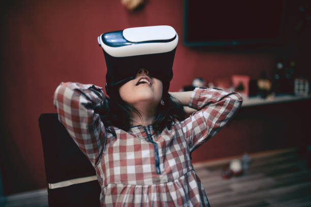 istock Little Girl Having Fun with Virtual Reality Simulator and Gesturing 851438520