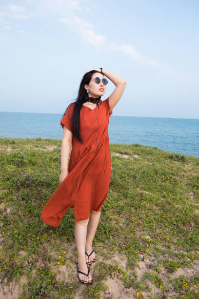 istock Young woman standing on coast 851448678