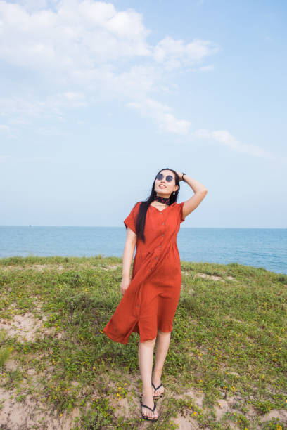 istock Young woman standing on coast 851448886