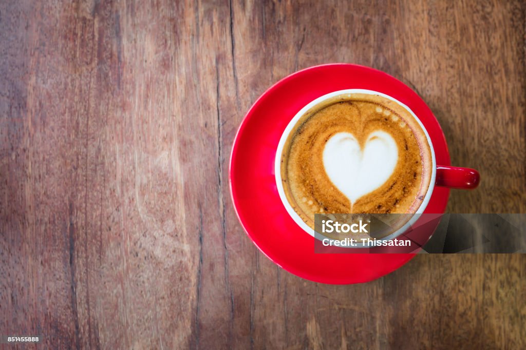 top view Heart latte art hot coffee on old wooden table as love and romantic concept Coffee - Drink Stock Photo