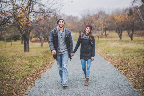 istock Couple in the autumn park 851463454