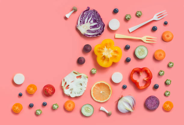 istock Colourful flat lay assorted sliced vegan food on pastel colour background. 851463680
