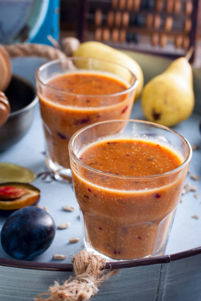 istock Smoothies with plum, pear, sunflower seeds and honey, selective focus 851468334