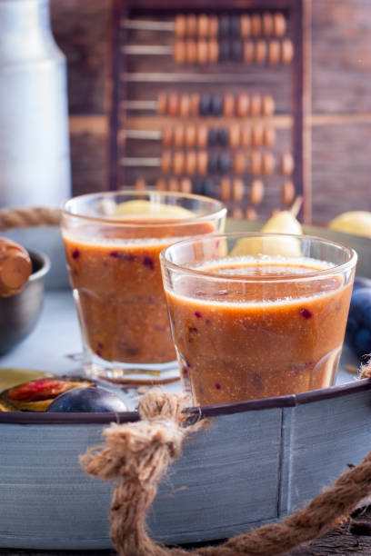 istock Smoothies with plum, pear, sunflower seeds and honey, selective focus 851468466
