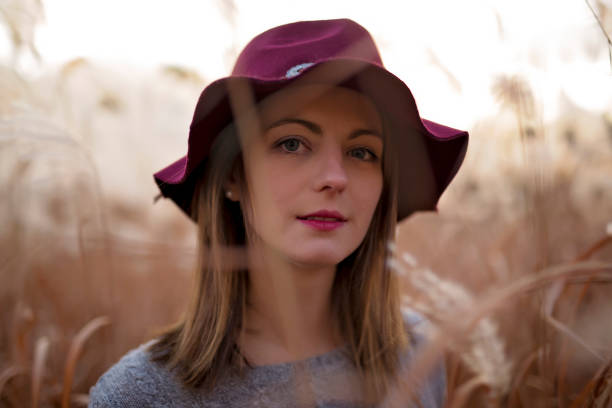 istock Woman in a wheat field at sunset 851479216