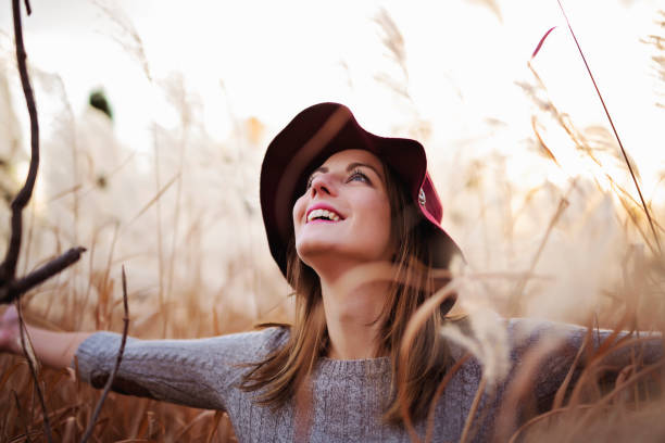 istock Woman in a wheat field at sunset 851479430