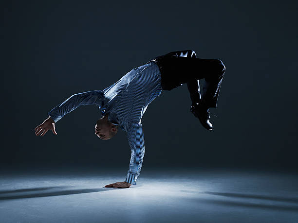 businessman flipping over backwards - skill vitality agility strength ストックフォトと画像
