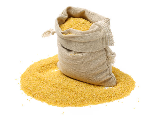 istock Raw uncooked millet in bowl and a bag， white background， 851482670