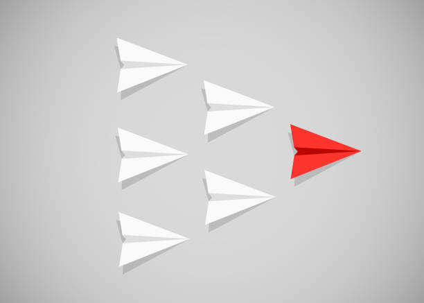 istock Red paper airplane as a leader among white airplanes. Leadership, teamwork, motivation concept. 851493652