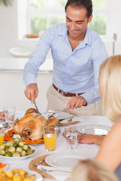 istock Man standing to carve the turkey 851497010