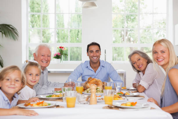 istock Family smiling at thanksgiving 851497442