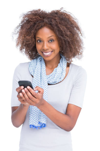 istock Smiling woman looking at camera and typing a text message 851502012