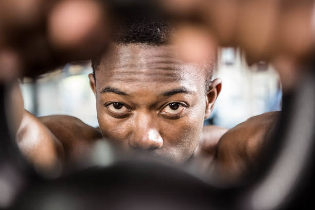istock Shirtless man lifting heavy kettlebell 851502230