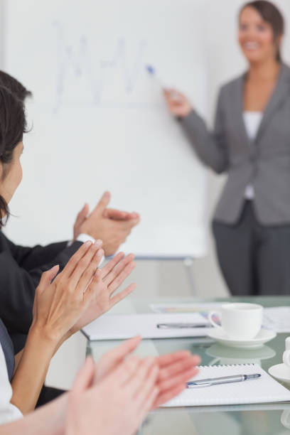istock Businesspeople applauding their colleague 851505316