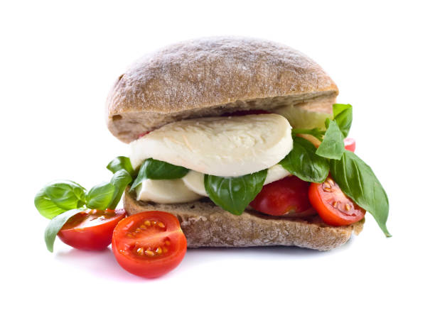 istock Ciabatta with mozzarella, tomato and basil isolated on white 851507414