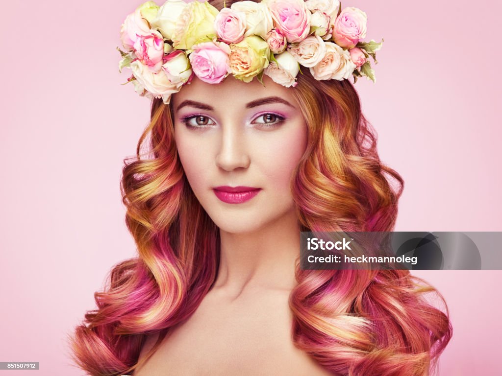 Beauty fashion model girl with colorful dyed hair Beauty fashion model girl with colorful dyed hair. Girl with perfect makeup and hairstyle. Model with perfect healthy dyed hair. Flower wreath on head Coloring Stock Photo