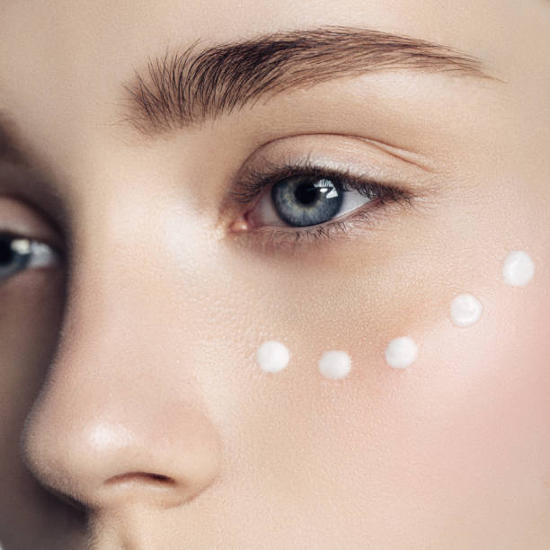 istock Beautiful woman with cream dots on the face 851510278