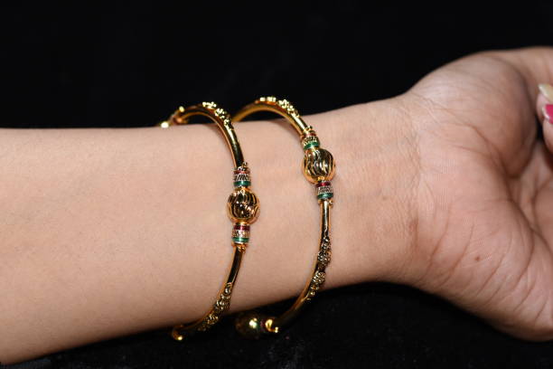 istock Fancy gold looking imitation bangles / bracelets on the woman's wrist 851516232