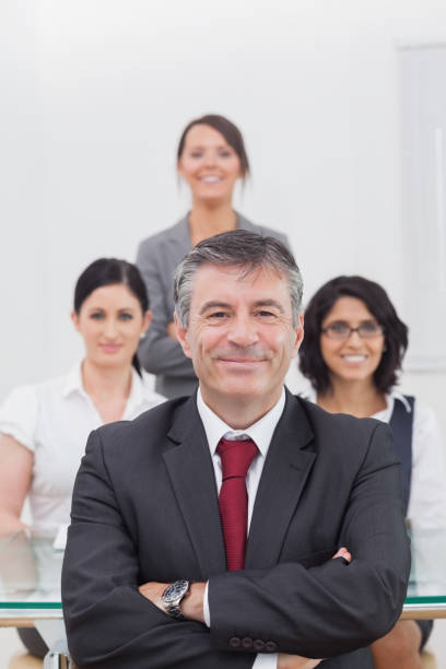 istock Portrait of businessman with team 851532986