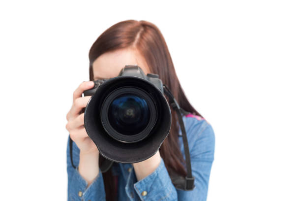 istock Cute young photographer taking picture of camera 851538032
