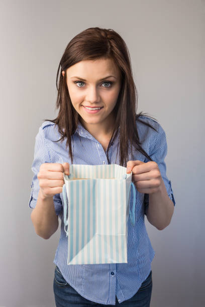 Cheerful pretty brunette receiving a present