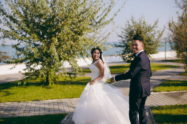 istock Wedding couple on a promenade on the waterfront 851547962