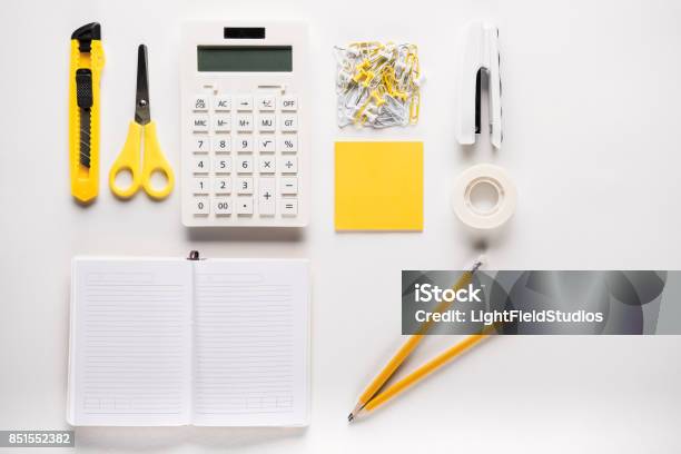 Foto de Material Escolar Com Caderno e mais fotos de stock de Calculadora - Calculadora, Flat Lay, Grampeador
