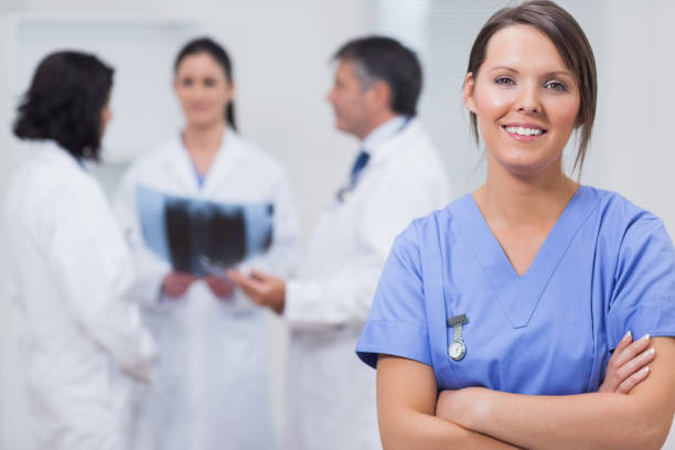 istock Nurse smiling with her team taking xray seriously 851552628