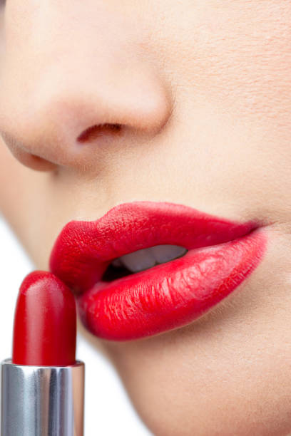 istock Extreme close up on gorgeous red lips being made up 851552980