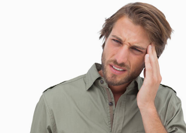 istock Man with headache looking away and wincing 851553204