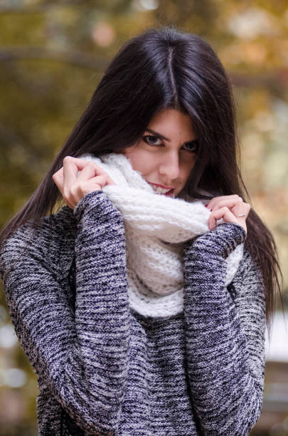 istock Young woman holding a white scarf 851553396