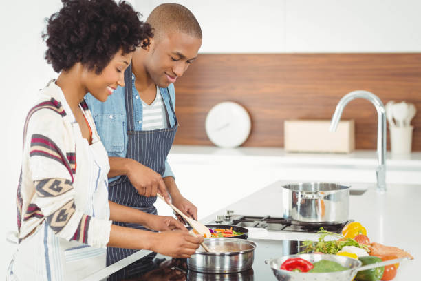 istock Happy couple cooking together 851557156