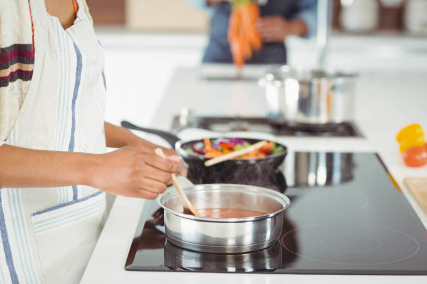 istock Happy couple preparing meal 851557856